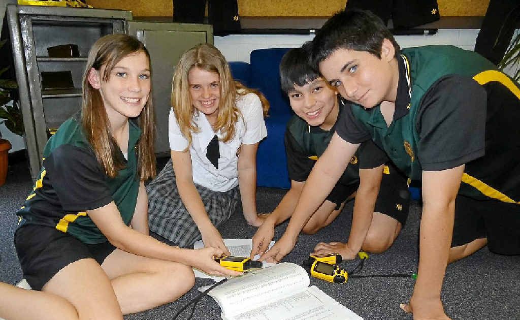 QUIET ACHIEVERS: James Nash Year 8 students Karlie Browne, Eliza Parker, Lance Miller and Mitchell Swift check out some of the activities involving geocaching instruments on offer to visiting Year 7s on Saturday. QUIET ACHIEVERS: James Nash Year 8 students Karlie Browne, Eliza Parker, Lance Miller and Mitchell Swift check out some of the activities involving geocaching instruments on offer to visiting Year 7s on Saturday.
